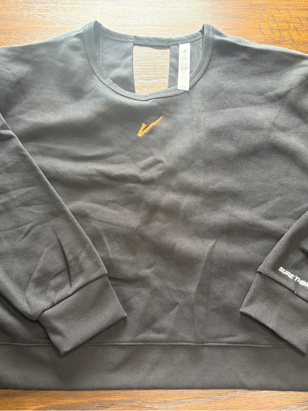 Beachbody’s Megan Davies Signature Open-Back Black Crewneck Sweatshirt